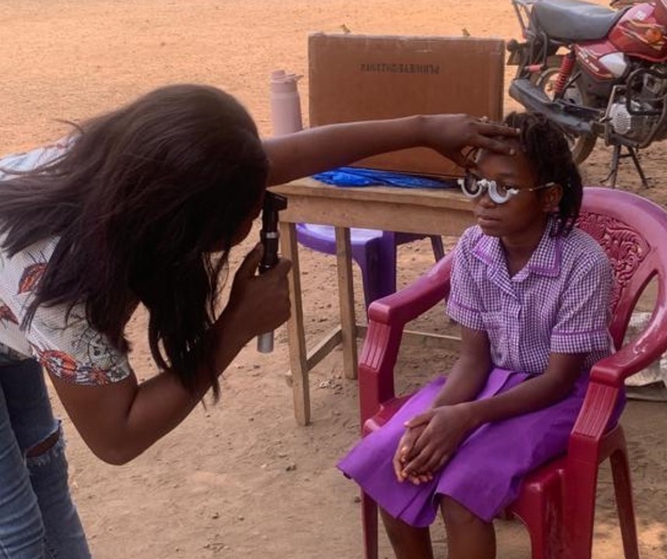 Isha getting an eye exam through Optometry Giving Sight
